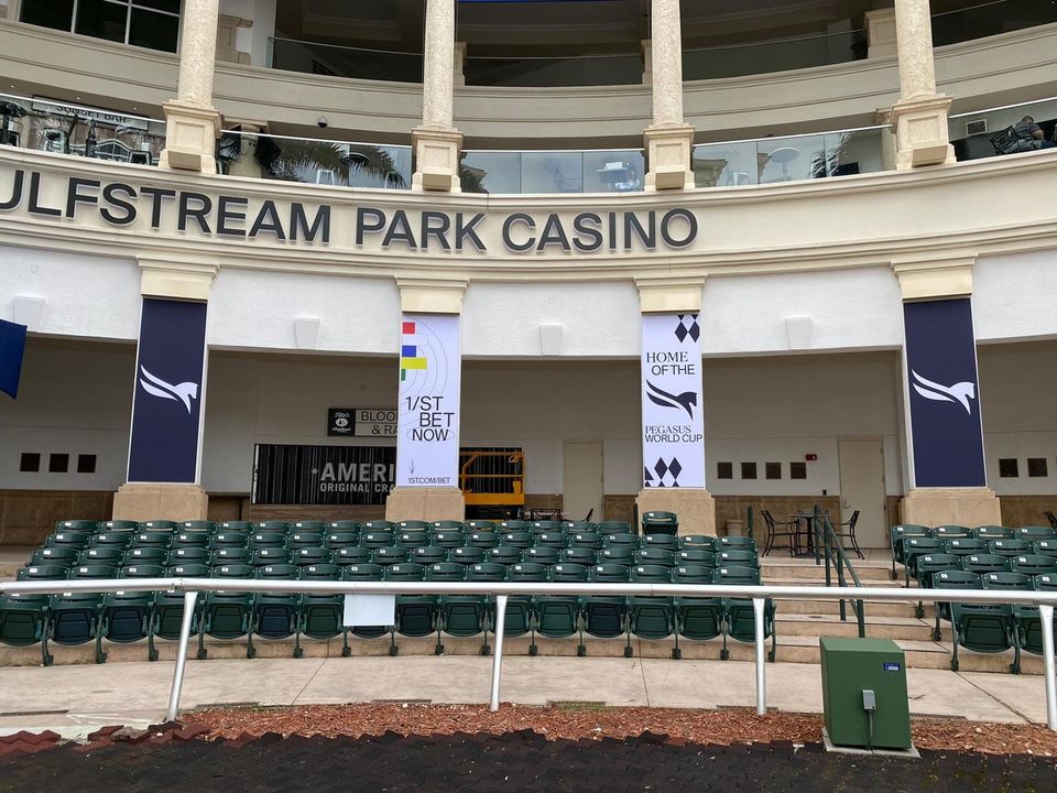 Gulfstream Park Casino entrance with Pegasus World Cup and 1/ST BET banner panels mounted between the columns